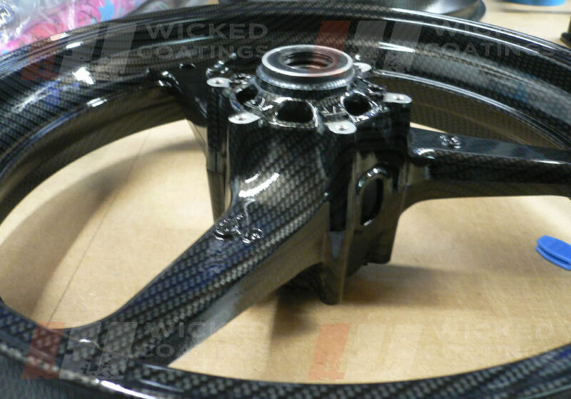 cross view of carbon dipping on a motorcycle wheel