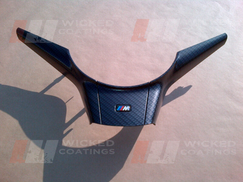 carbon dipped BMW interior part with satin lacquer finish