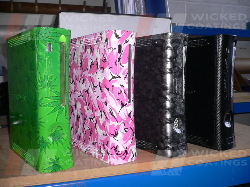 Xbox 360 with various water transfer printing designs.