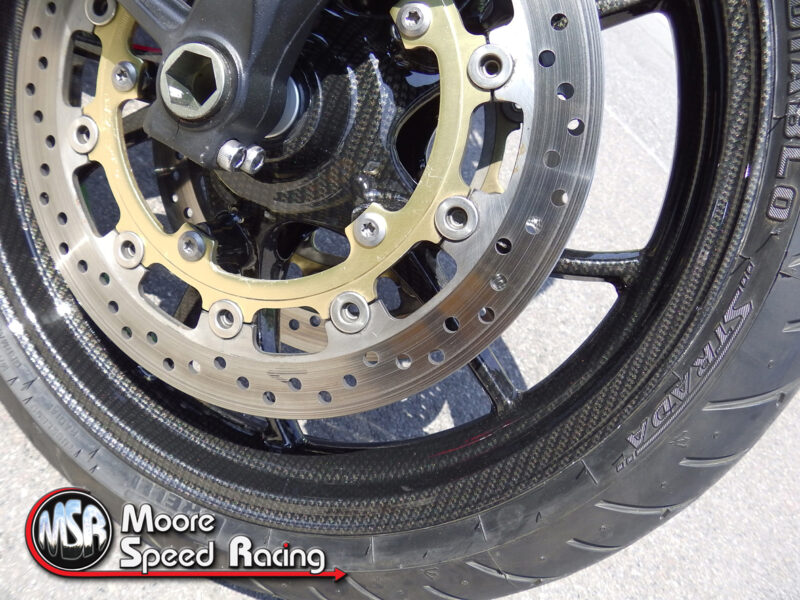 Carbon dipping on a Triumph Street Triple by hydrographics team at Wicked Coatings