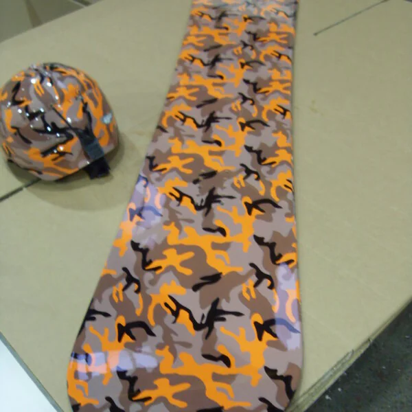 Snowboard and snowboarding helmet custom dipped in fancy shapes