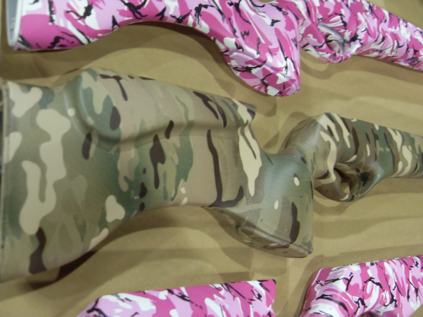Pink camo and military camo guns