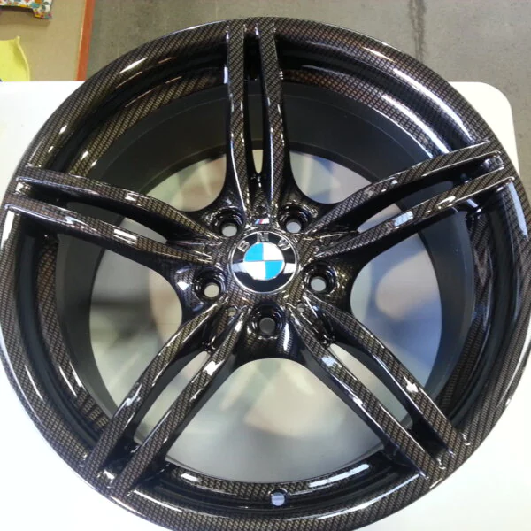 BMW M-Power alloy wheels coated in carbon fibre painted black