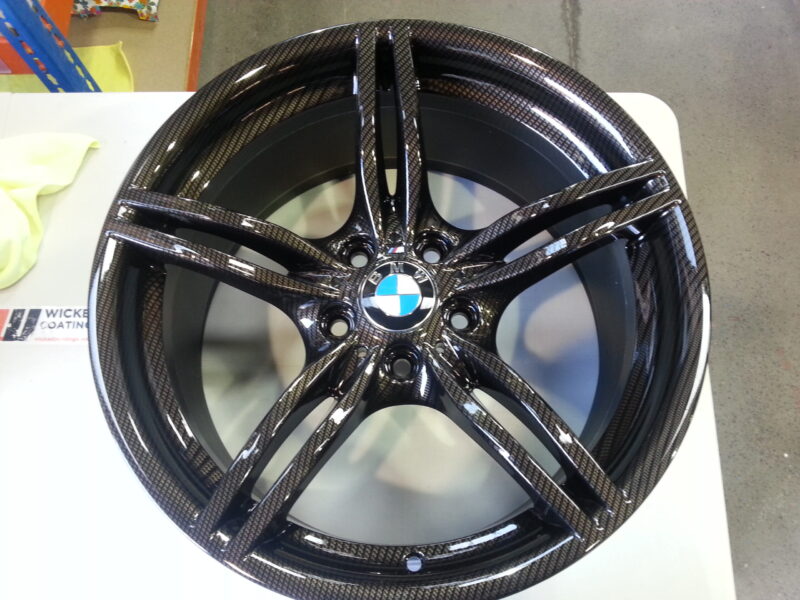 BMW M-Power alloy wheels coated in carbon fibre painted black