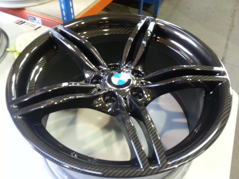 BMW M-Power alloy wheels coated in carbon fibre painted black