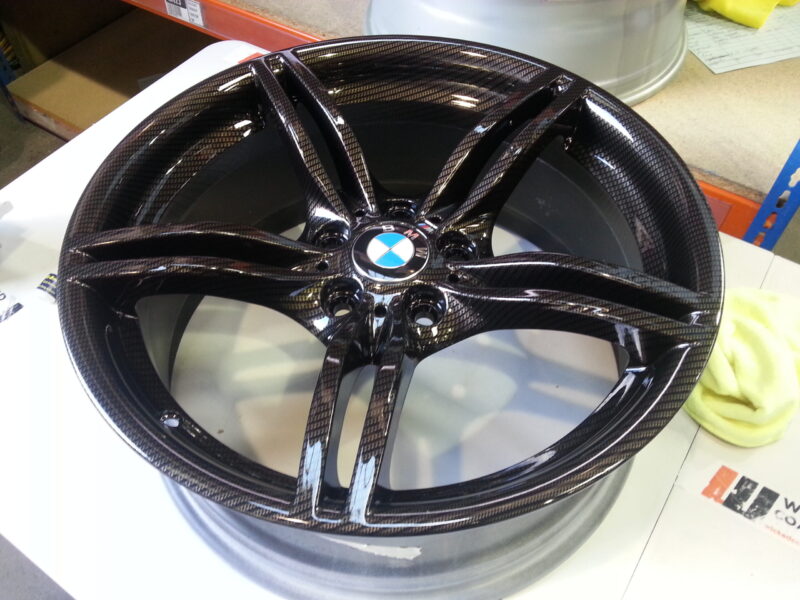 BMW M-Power alloy wheels coated in carbon fibre painted black