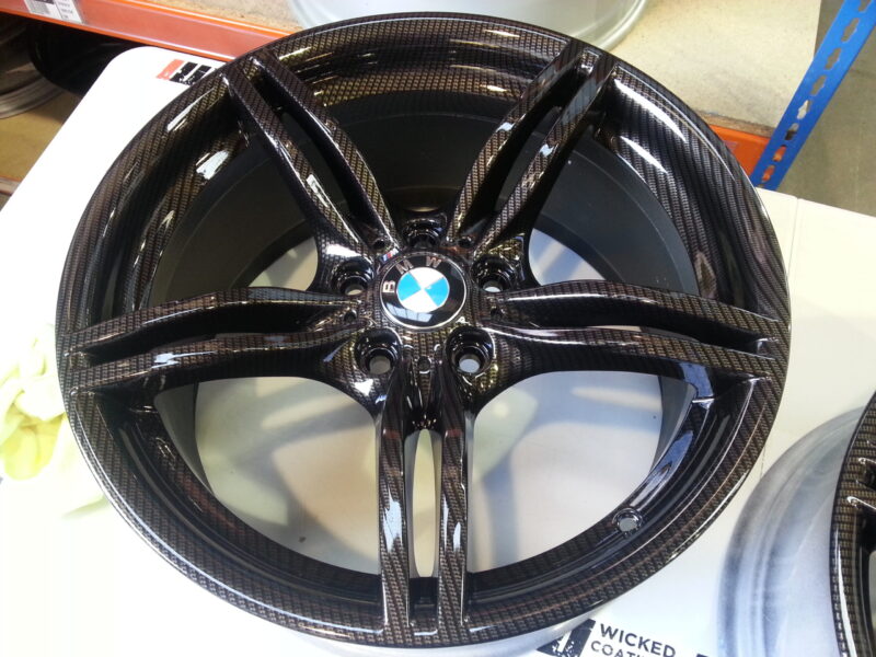 BMW M-Power alloy wheels coated in carbon fibre painted black