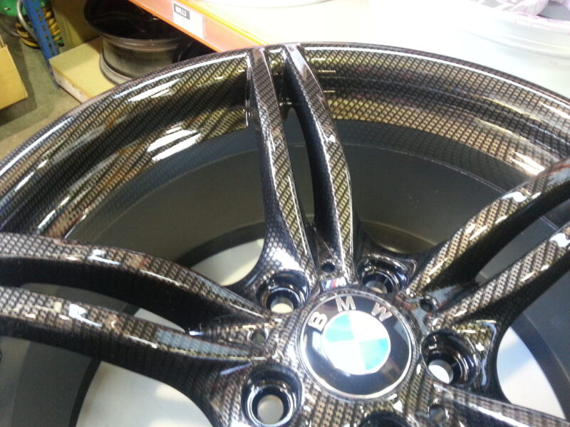 BMW M-Power alloy wheels coated in carbon fibre painted black