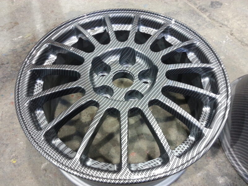 Car alloy wheels coated in carbon fibre painted silver