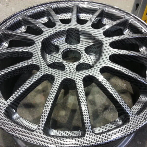 Car alloy wheels coated in carbon fibre painted silver