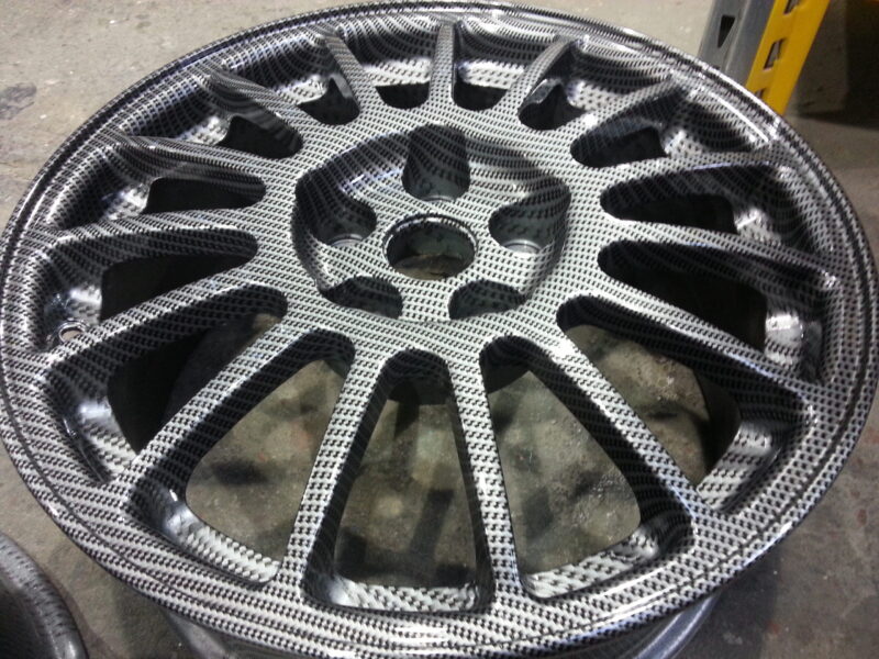 Car alloy wheels coated in carbon fibre painted silver