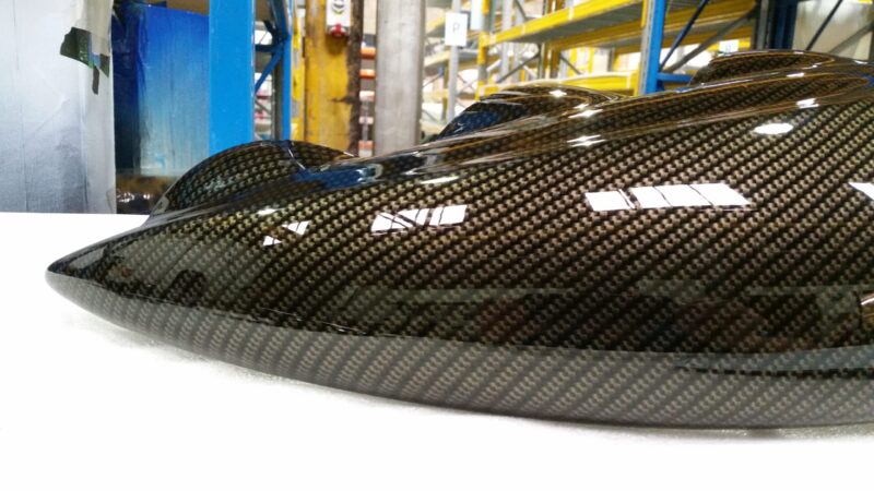 Car interior elements coated in carbon fibre