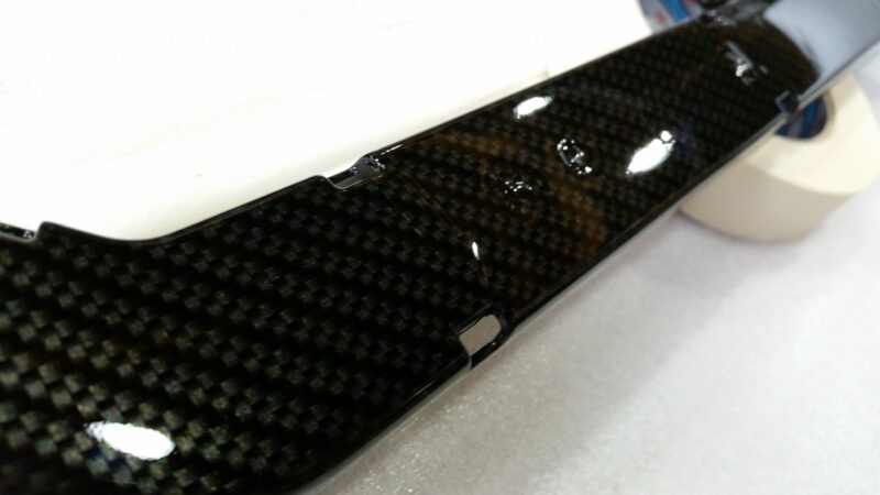 Car engine elements coated in carbon fibre hydrographic film painted black