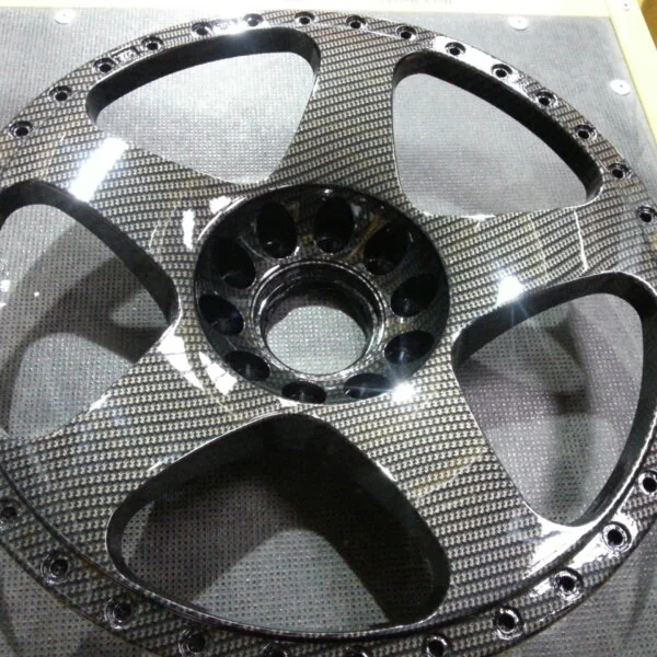 Car alloy wheels coated in carbon fibre hydrographic film painted black