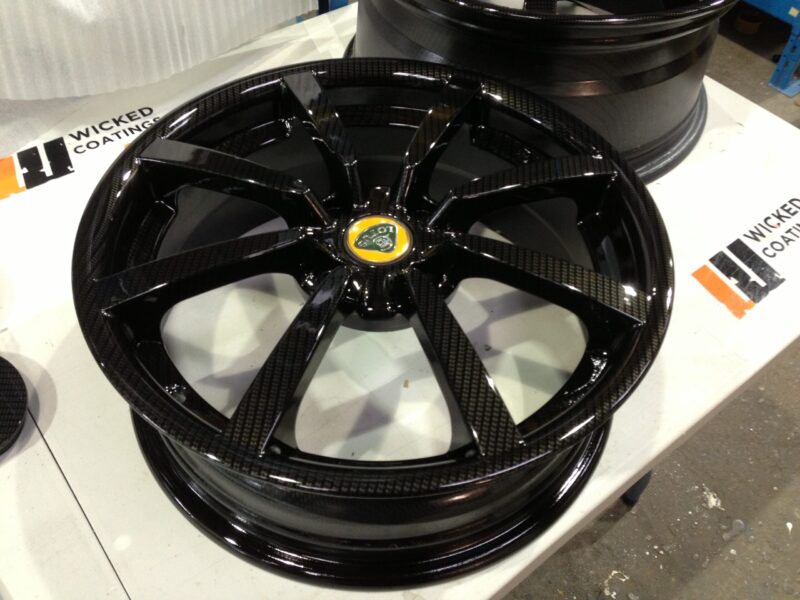 Lotus wheels coated in carbon fibre painted black