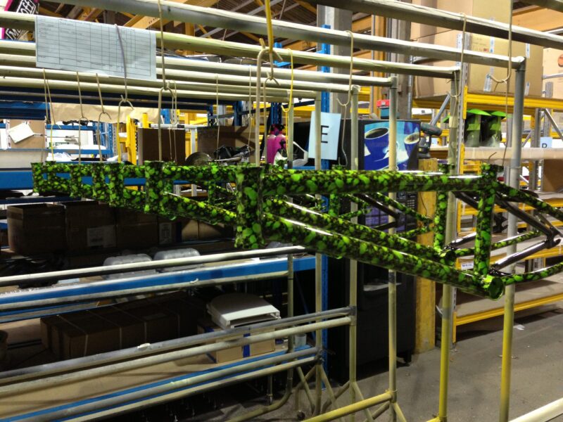 Bike frame coated in skull pattern painted green