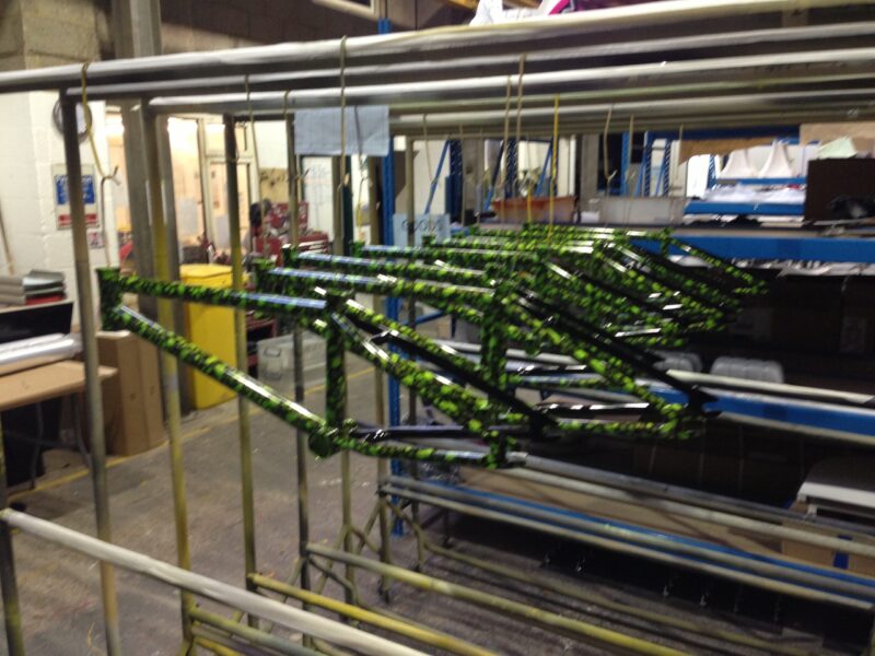 Bike frame coated in skull pattern painted green