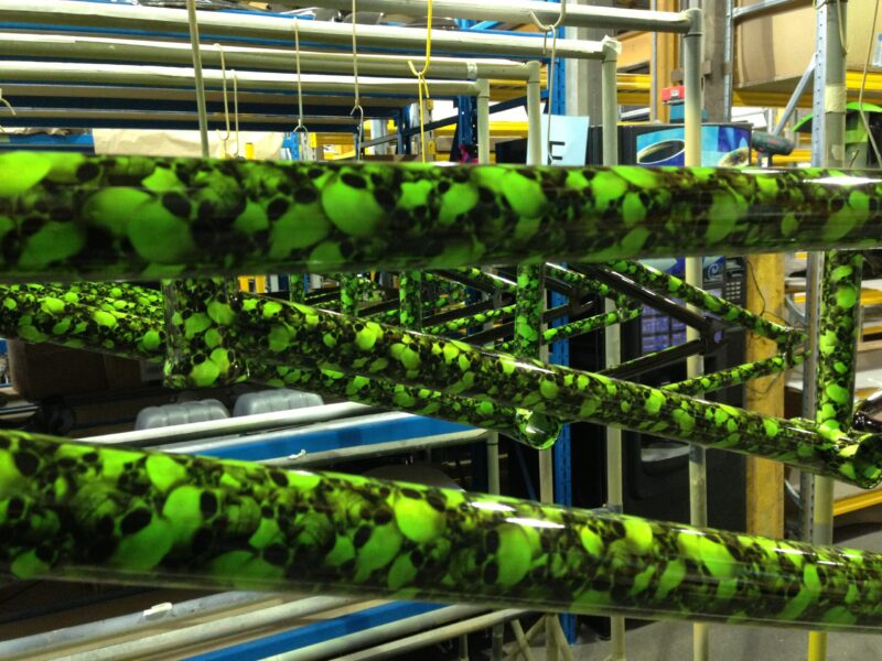 Bike frame coated in skull pattern painted green