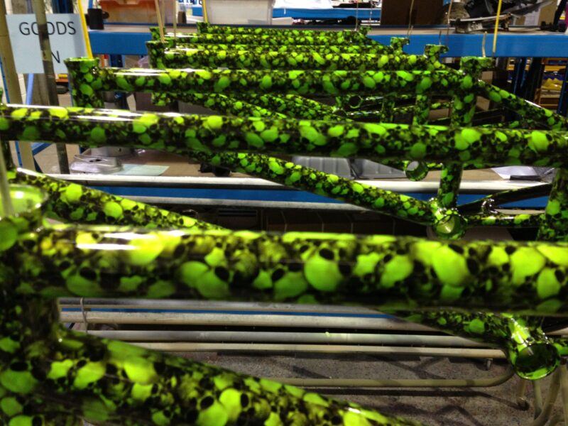 Bike frame coated in skull pattern painted green