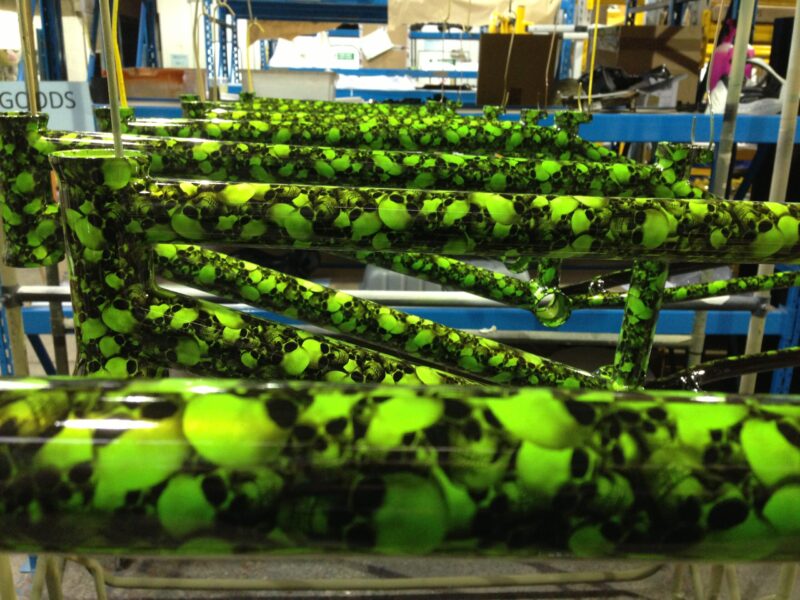 Bike frame coated in skull pattern painted green