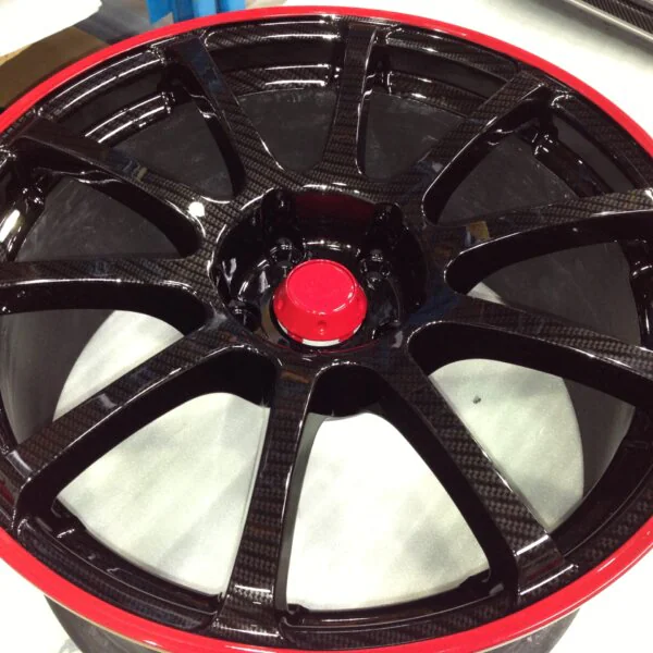Car Alloy Wheels Coated In Carbon Fibre Painted Black And Red