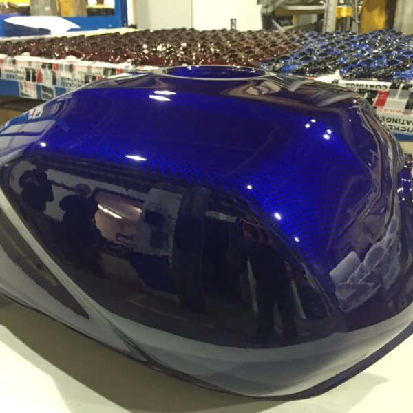Motorbike tank coated in carbon fibre painted blue