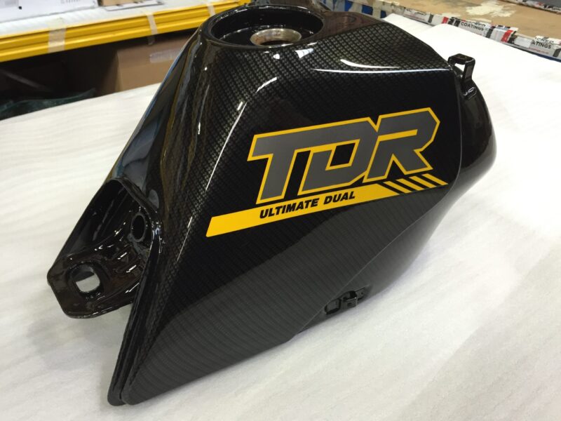 Motorbike tank coated in carbon fibre