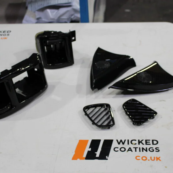 Car interior parts coated in carbon fibre