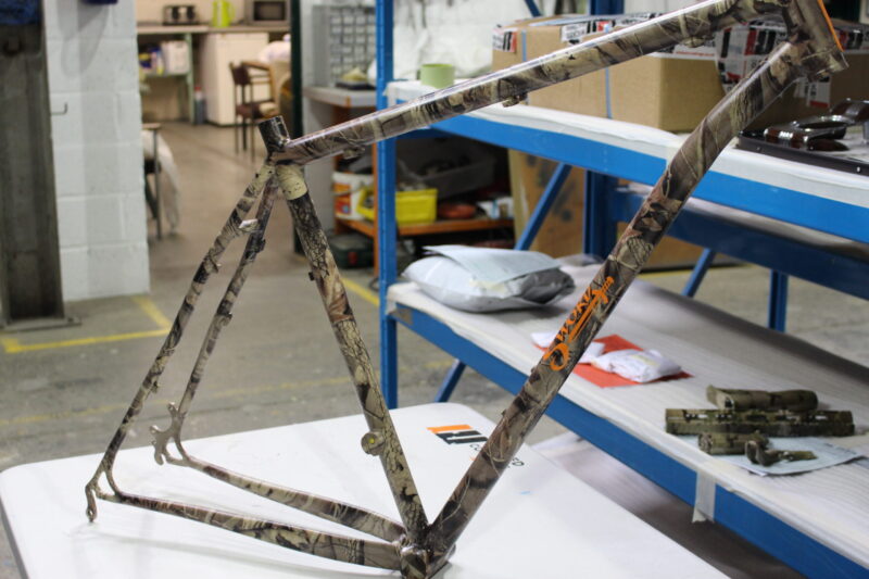 Bike frame coated in camo pattern