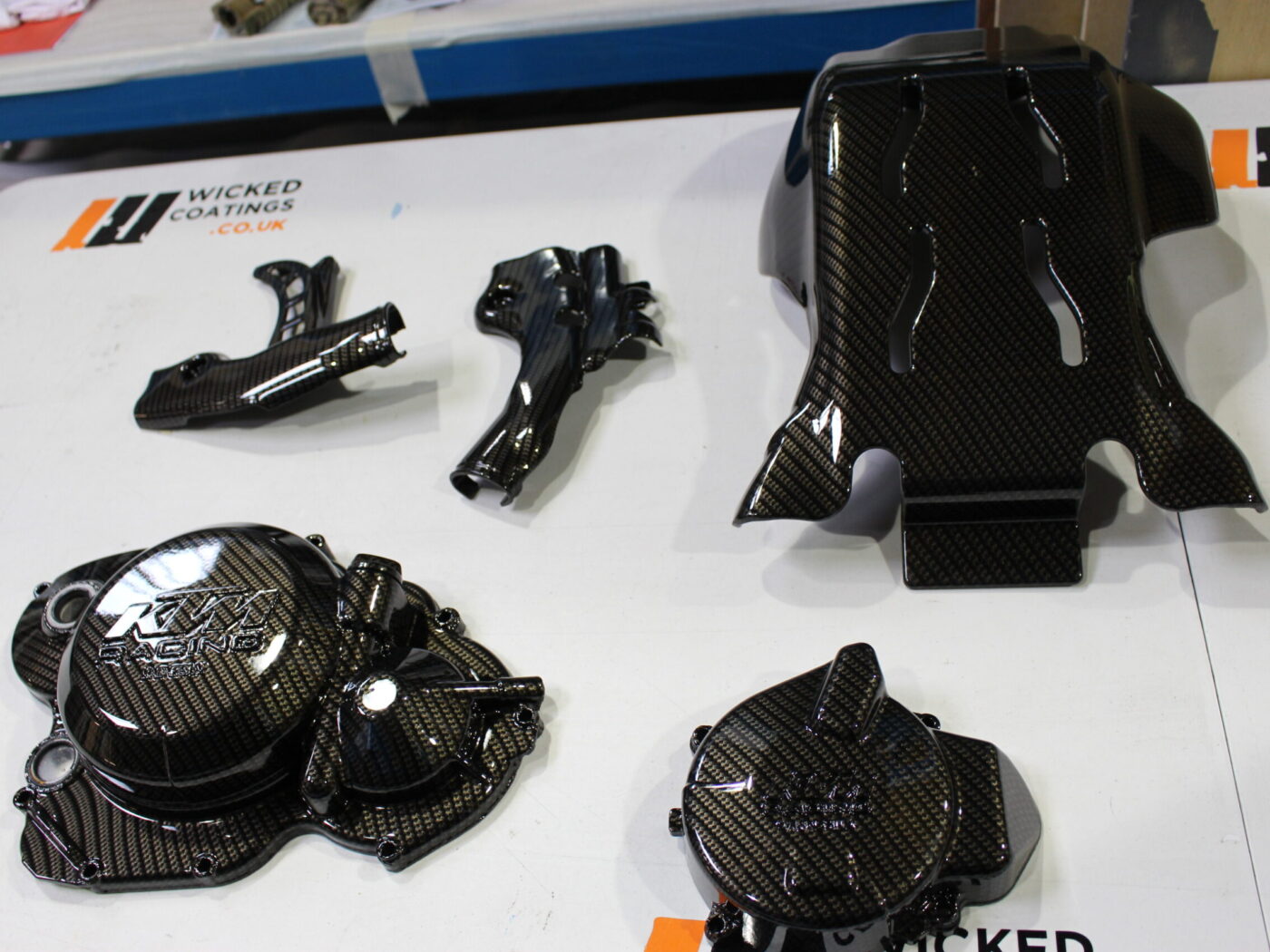 Motorbike engine parts coated in Carbon Fibre hydrographic film