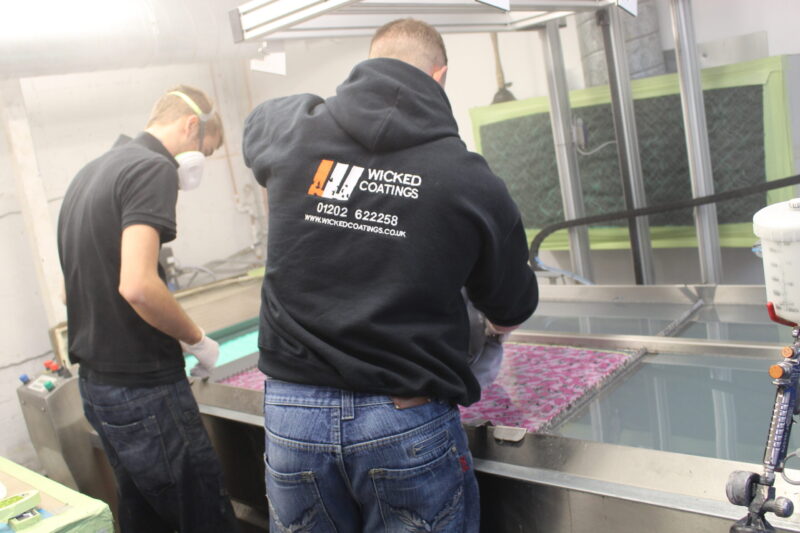 Motorbike tank painted in white, coated in fancy como hydrographic film.