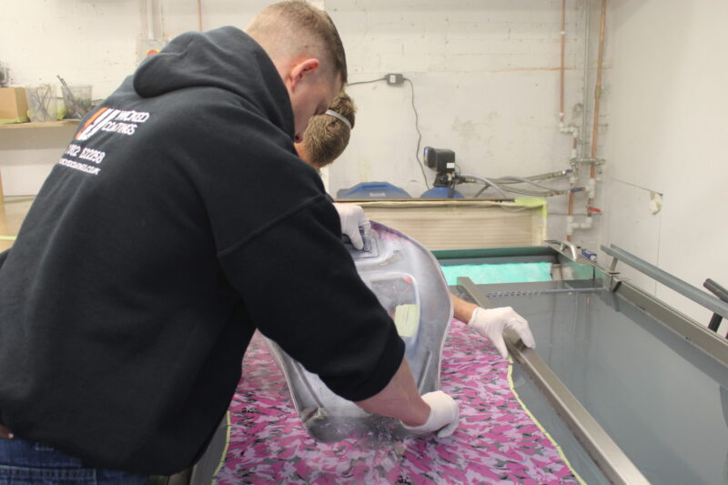 Motorbike tank painted in white, coated in fancy como hydrographic film.