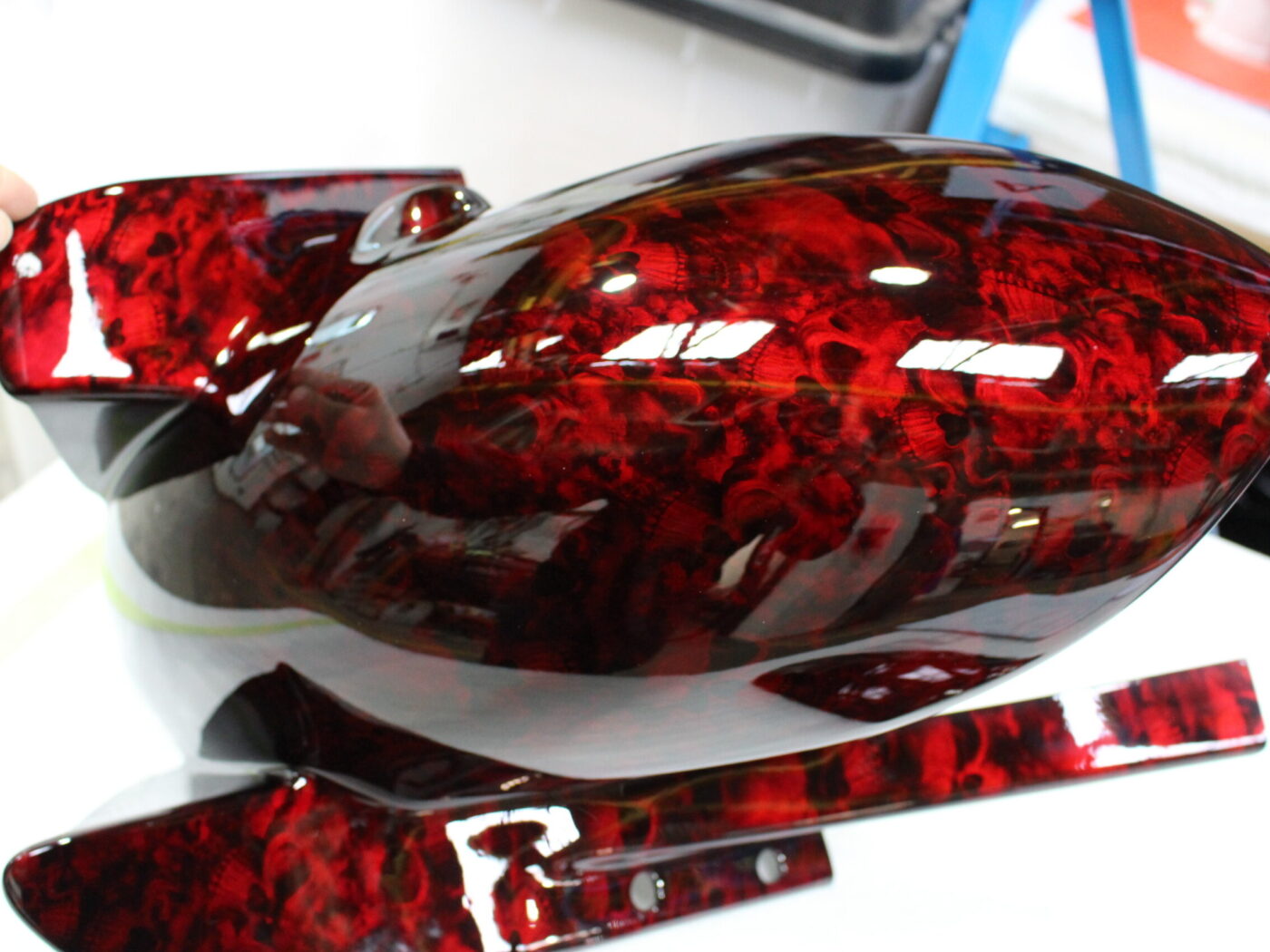 Motorbike parts coated in skull pattern painted red
