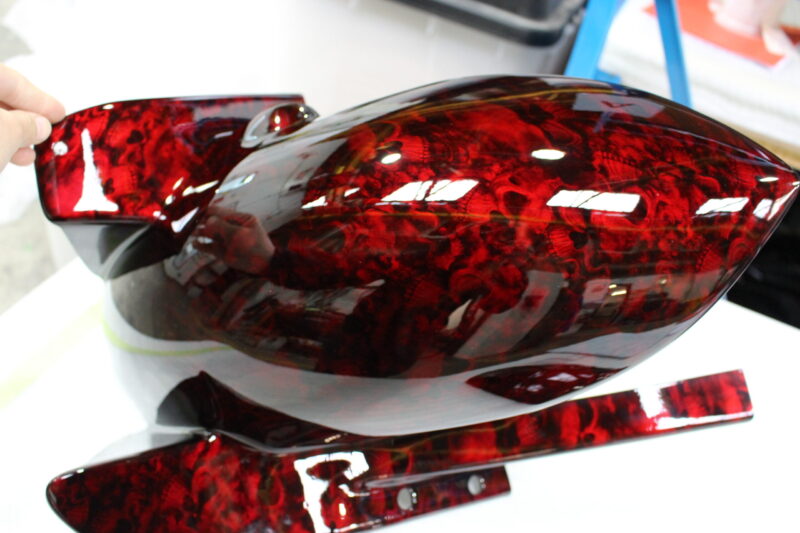 Motorbike parts coated in skull pattern painted red