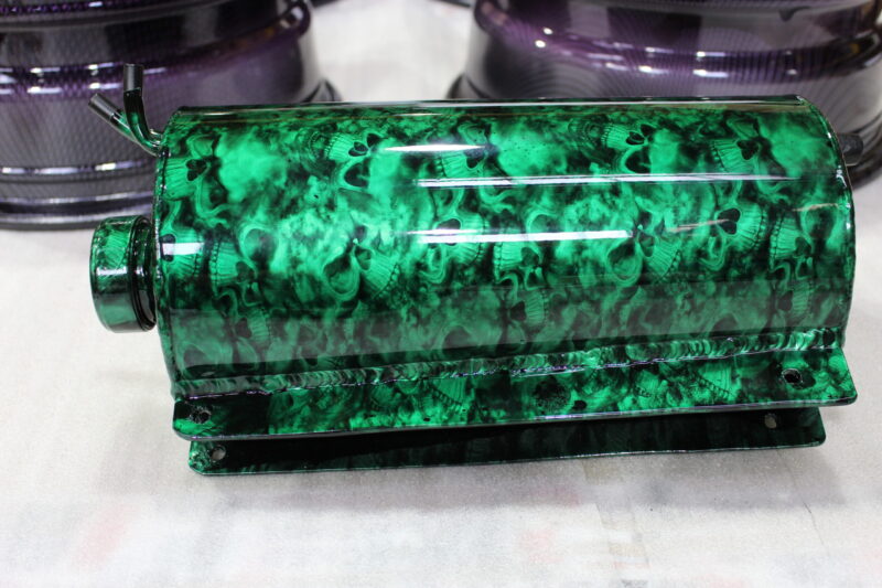 Exhaust coated in skull pattern painted green
