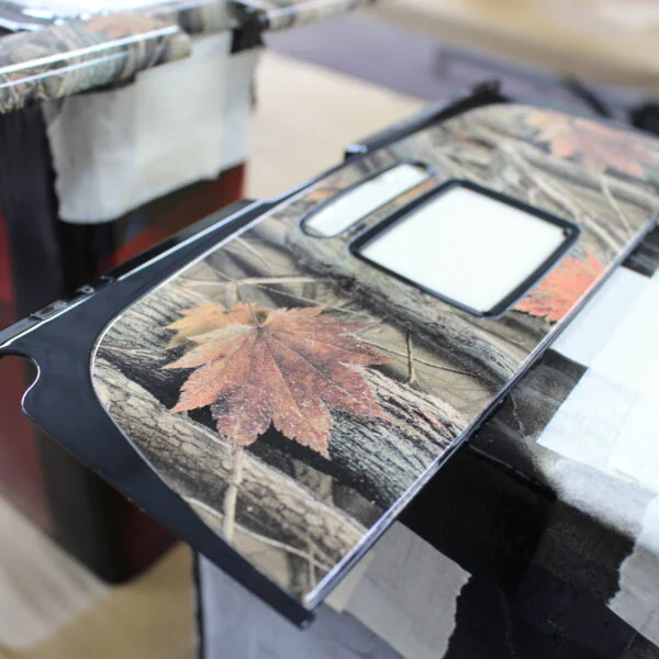 Parts of dashboard coated in camouflage hydrographic film