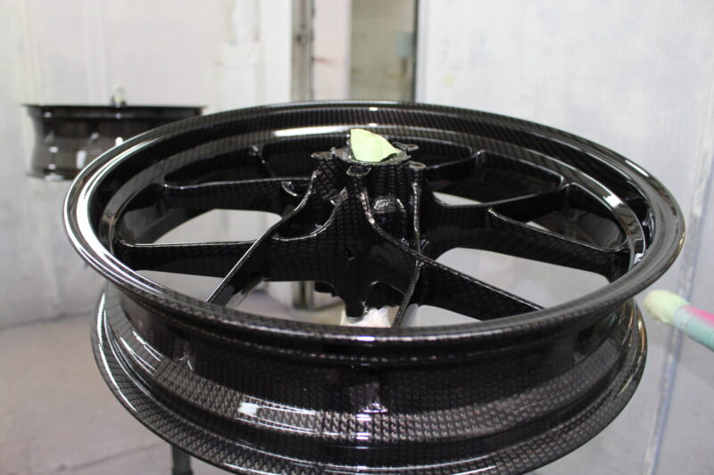Motorbike wheels coated in carbon fibre