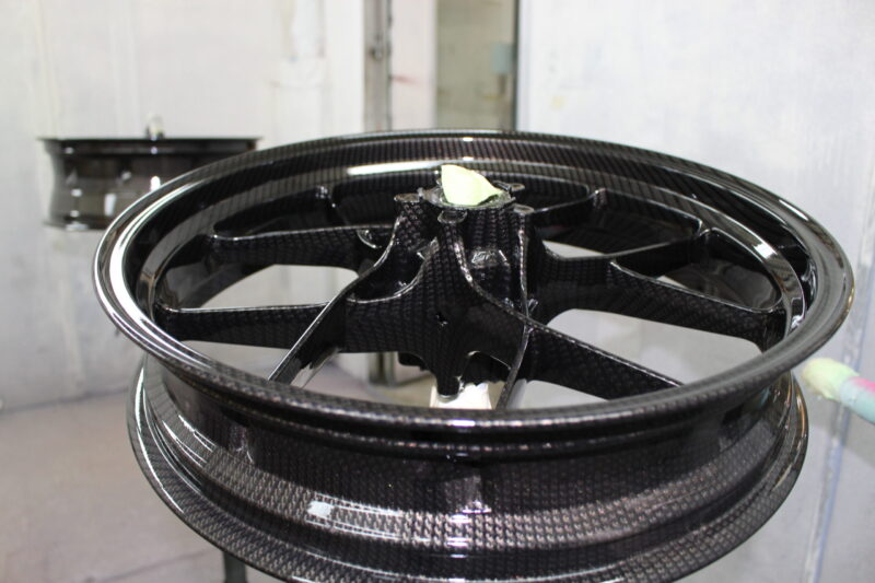 Motorbike wheels coated in carbon fibre