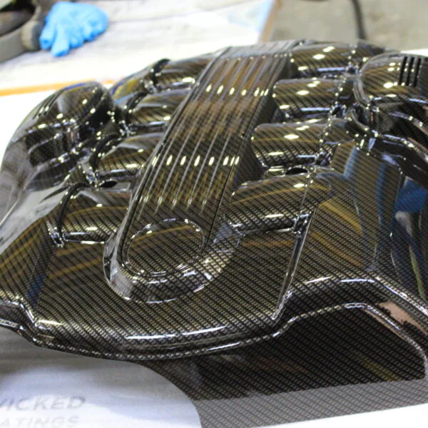 BMW engine elements coated in carbon fibre
