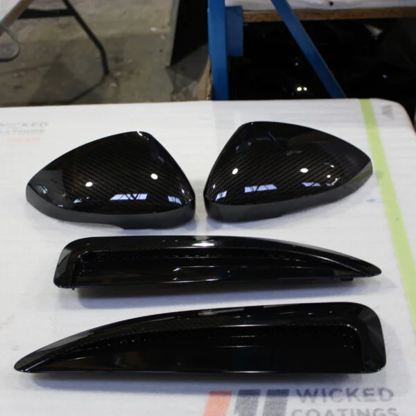 Car exterior elements coated in carbon fibre