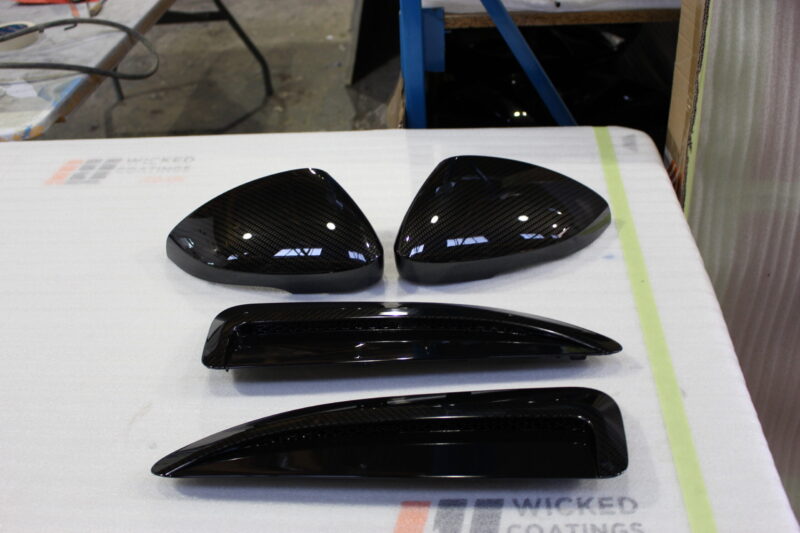 Car exterior elements coated in carbon fibre