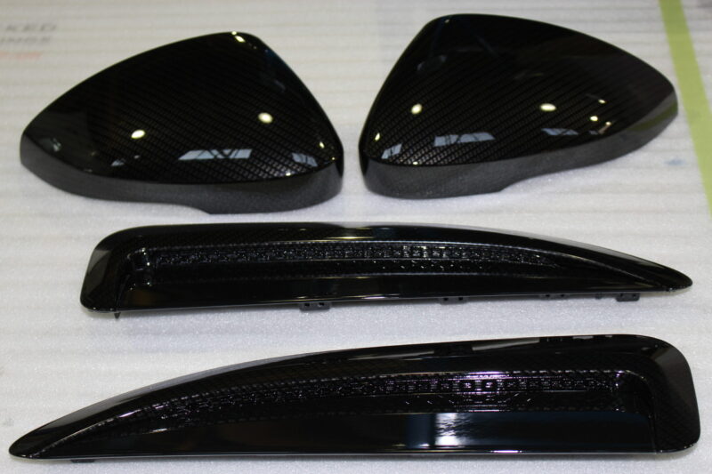 Car exterior elements coated in carbon fibre