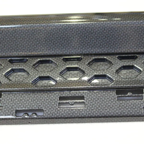 Car interior elements coated in carbon fibre