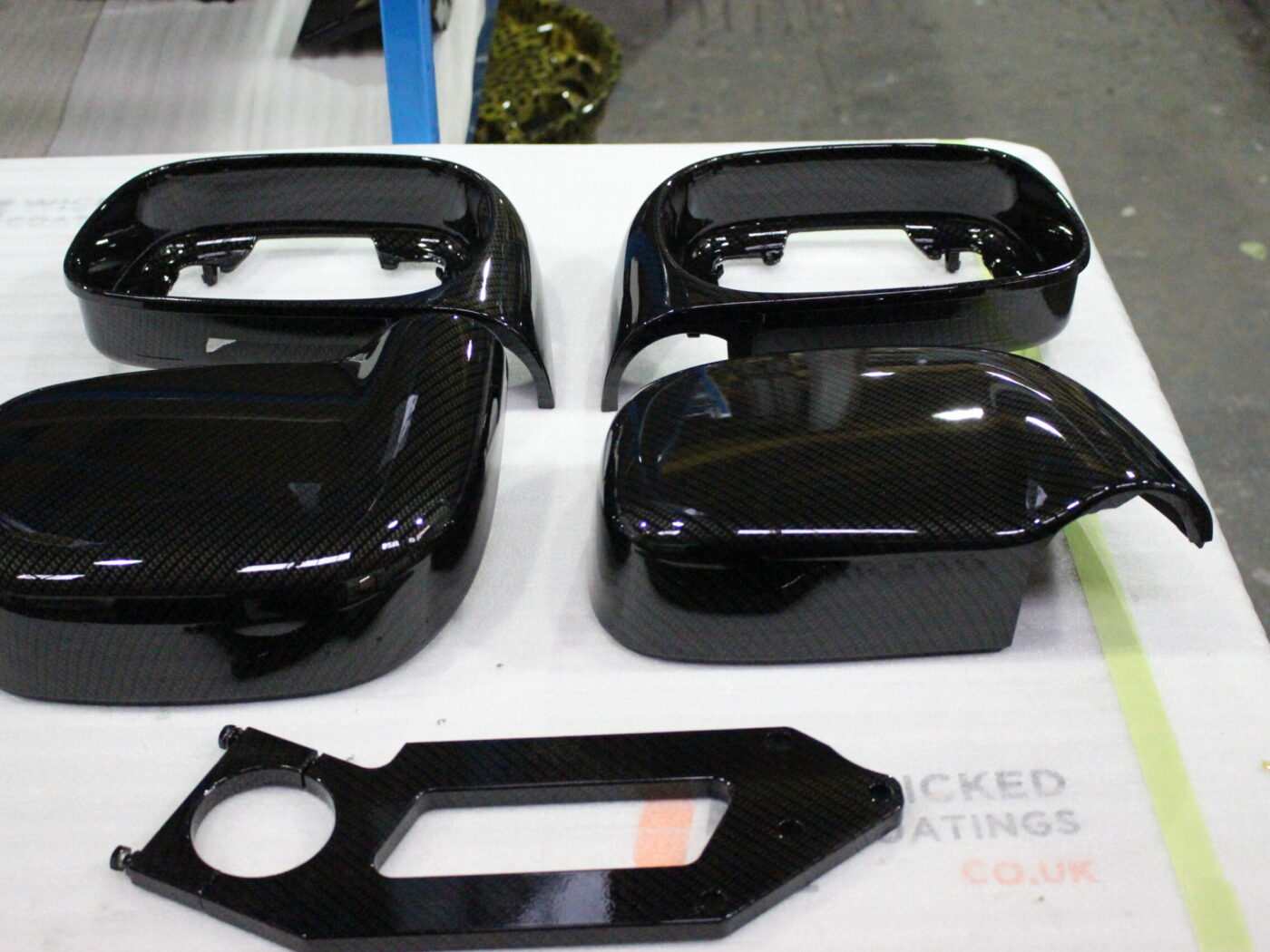 Car mirrors cover coated in carbon fibre