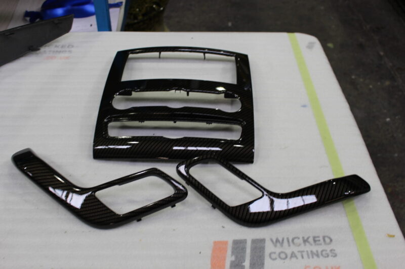 VW dashboard elements coated in carbon fibre