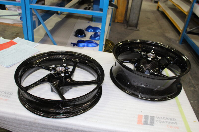 Motorbike wheels coated in carbon fibre