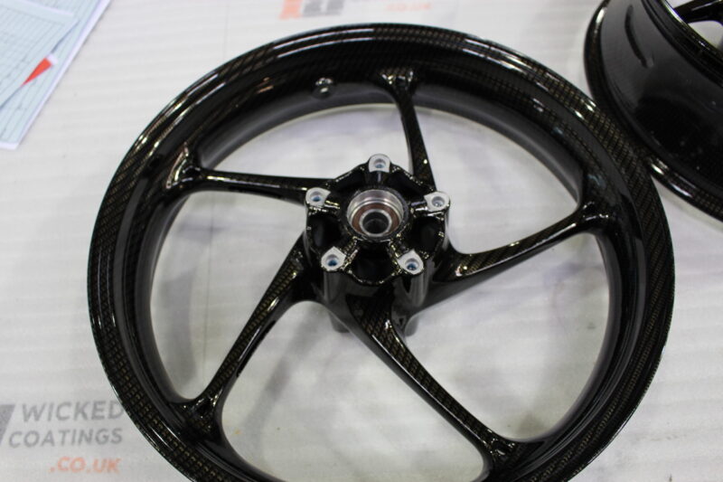 Motorbike wheels coated in carbon fibre