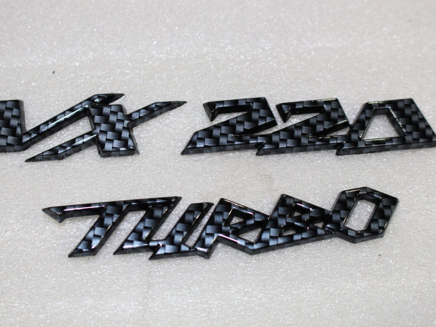 Vauxhall VX 220 Turbo badge coated in carbon fibre