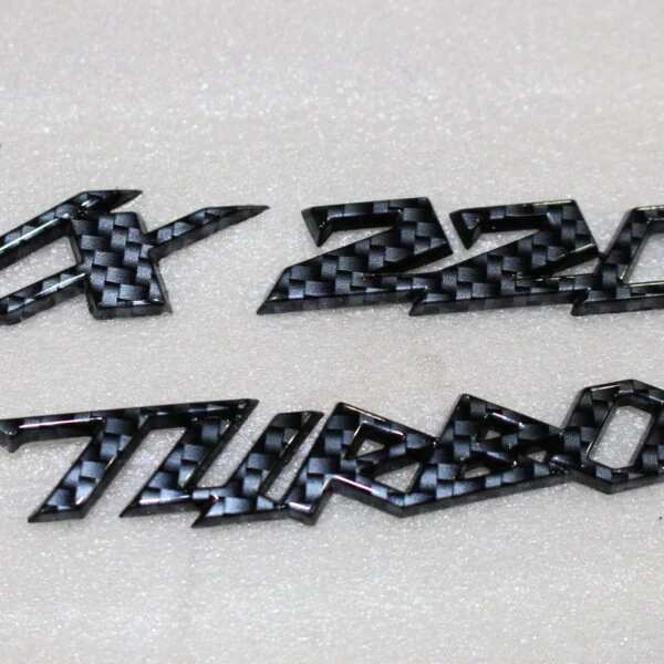 Vauxhall VX 220 Turbo badge coated in carbon fibre