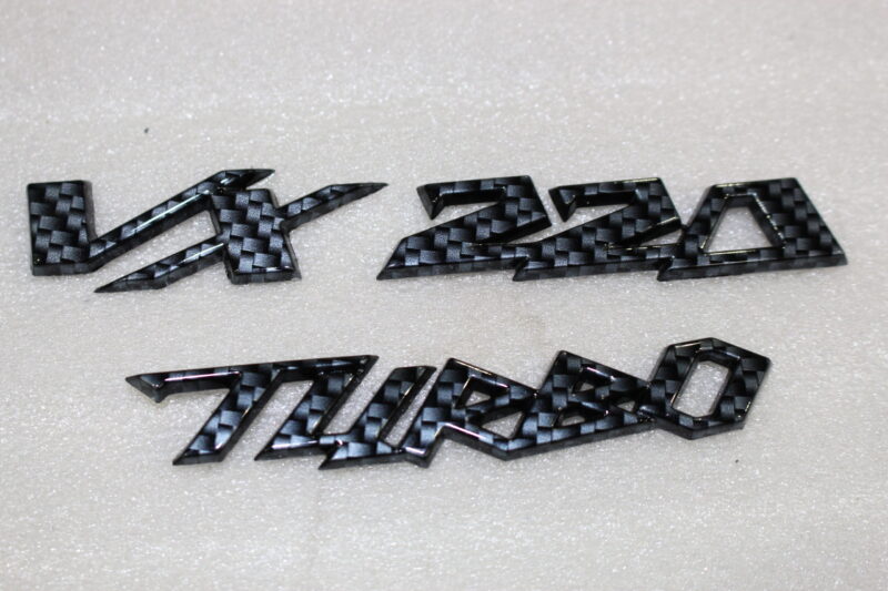 Vauxhall VX 220 Turbo badge coated in carbon fibre